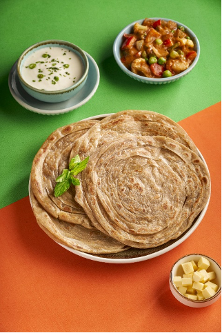 Goeld laccha paratha served with curd