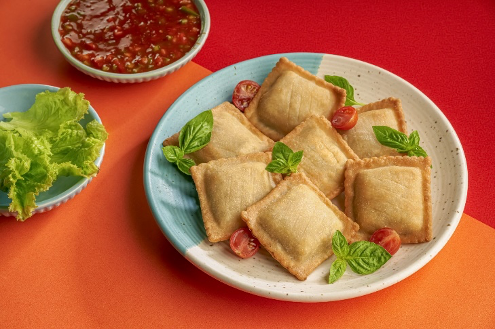 Goeld pizza pocket served with dip sauce