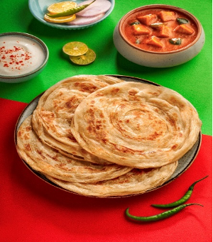 Goeld premium Malabar paratha served with onion salad and pickle